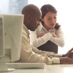 Business Colleagues Working with Laptop